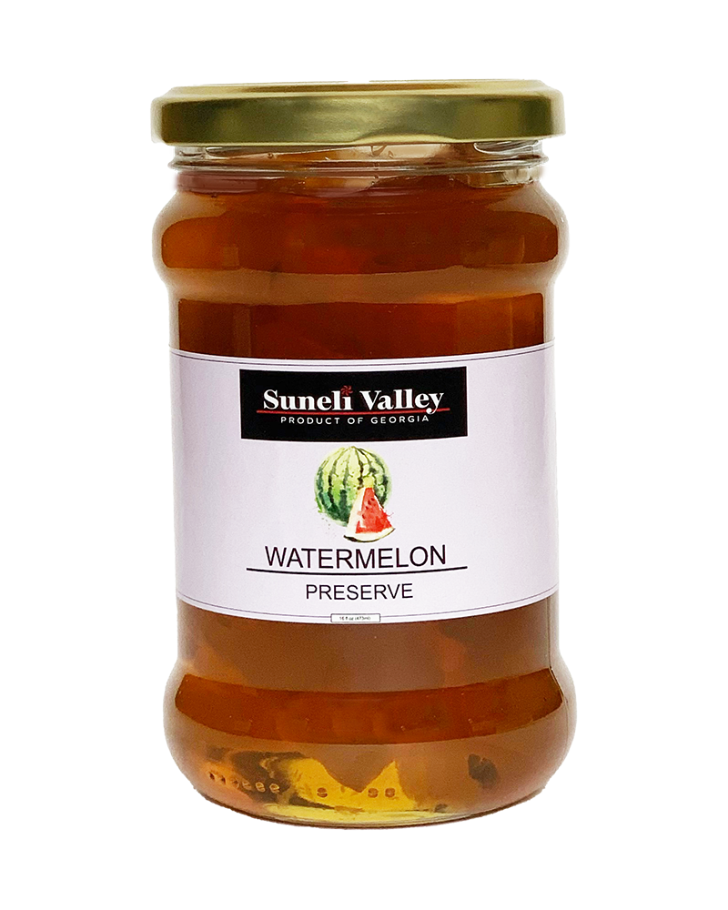 A mid size bottle of watermelon preserve. Watermelon preserves can be used in baked dishes.