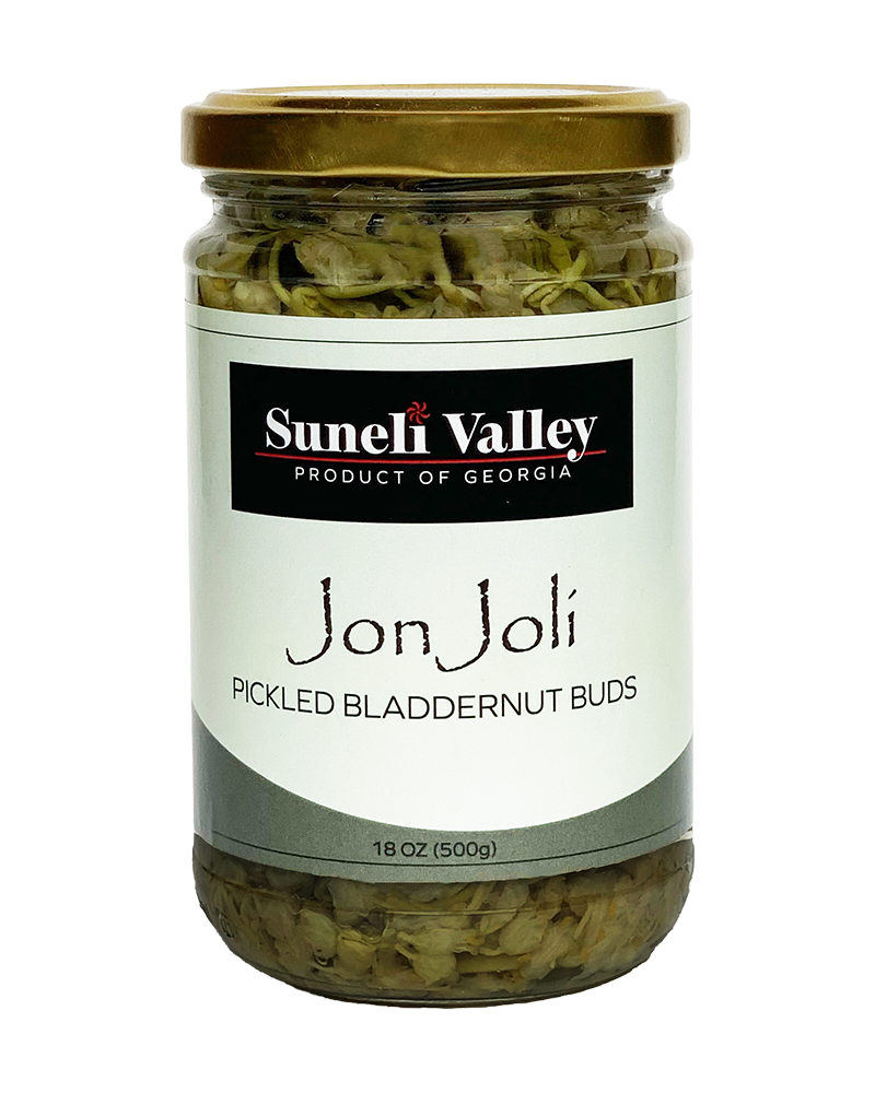A mid-size bottle of Jon Joli. Georgian pickled bladdernut can be used as an appetizer or ingredient for dishes in your kitchen.