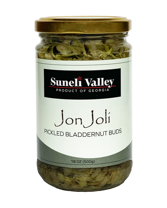 A mid-size bottle of Jon Joli. Georgian pickled bladdernut can be used as an appetizer or ingredient for dishes in your kitchen.